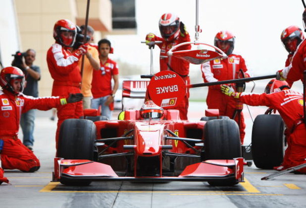 SAKHIR, BAHRAIN - FEBRUARY 17: Kimi Raikkonen of Finland and Ferrari practices a pitstop during Formula One testing ahead of the 2009 Formula One season at the Bahrain International Circuit on February 17, 2009 in Sakhir, Bahrain. (Photo by Paul Gilham/