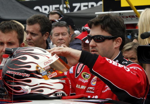 DAYTONA BEACH, FL - FEBRUARY 15: Tony Stewart, driver of the #14 Office Depot/Old Spice Chevrolet, prepares to climb into his car prior to the NASCAR Sprint Cup Series Daytona 500 at Daytona International Speedway on February 15, 2009 in Daytona Beach, F