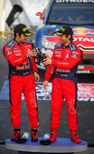 HAMAR, NORWAY - FEBRUARY 15: Sebastien Loeb (R) of France and Daniel Elena of Monaco, celebrate after overall victory in Rally Norway 2009 on February 15, 2009 in Hamar, Norway. (Photo by Reporter Images/Getty Images)