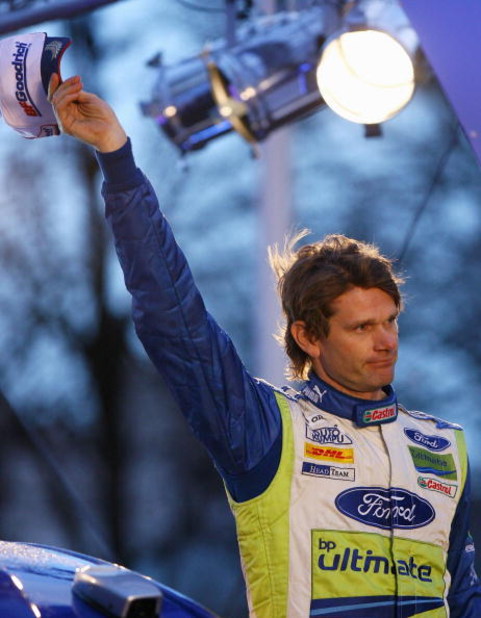 CARDIFF, UNITED KINGDOM - DECEMBER 02: Marcus Gronholm of Finland and Ford waves to the fans after completing his last rally during the Podium Finish of the 2007 FIA Wales Rally GB on December 2, 2007 Cardiff, Wales. (Photo by Ryan Pierse/Getty Images)