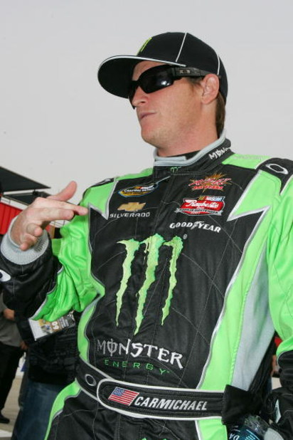FONTANA, CA - FEBRUARY 21: Ricky Carmichael, driver of the #4 Monster Energy Chevrolet, waits by his car before the NASCAR Camping World Truck Series San Bernardino County 200 at Auto Club Speedway on February 21, 2009 in Fontana, California. (Photo by
