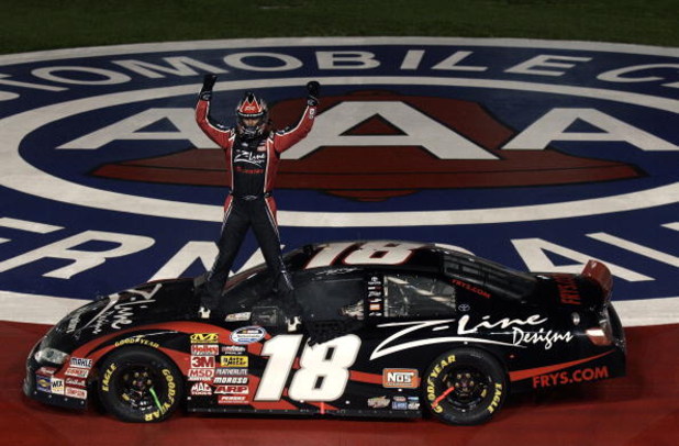 FONTANA, CA - FEBRUARY 21: Kyle Busch, driver of the #18 Z-Line Designs Toyota, celebrates winning the NASCAR Nationwide Series Stater Bros. 300 at Auto Club Speedway on February 21, 2009 in Fontana, California. (Photo by Jason Smith/Getty Images for NA