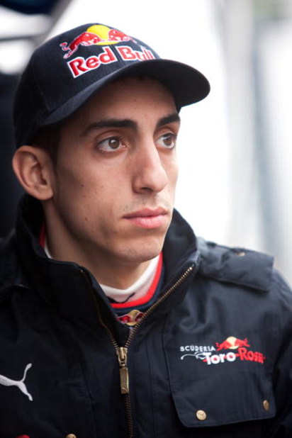 BARCELONA, SPAIN - MARCH 09: Sebastien Buemi of Switzerland and team Toro Rosso looks on in the pit lane during formula one testing at the Circuit de Catalunya on March 9, 2009 in Barcelona, Spain. (Photo by Peter Fox/Getty Images)