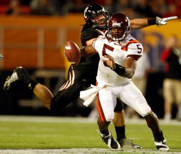 MIAMI - JANUARY 01: Connor Barwin #5 of the Cincinnati Bearcats tries to tackle Tyrod Taylor #5 of the Virginia Tech Hokies during the FedEx Orange Bowl at Dolphin Stadium on January 1, 2009 in Miami, Florida. (Photo by Streeter Lecka/Getty Images)