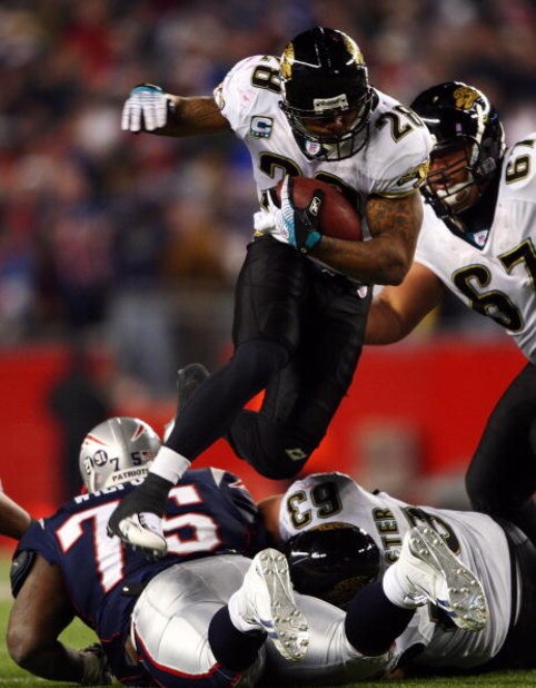 FOXBOROUGH, MA - JANUARY 12: Fred Taylor #28 of the Jacksonville Jaguars runs the ball against the New England Patriots during the AFC Divisional playoff game at Gillette Stadium game on January 12, 2008 in Foxboro, Massachusetts. (Photo by Elsa/Getty I