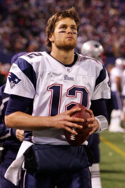 EAST RUTHERFORD, NJ - DECEMBER 29: Tom Brady #12 of the New England Patriots looks on from the sidelines against the New York Giants on December 29, 2007 at Giants Stadium in East Rutherford, New Jersey. (Photo by Jim McIsaac/Getty Images)