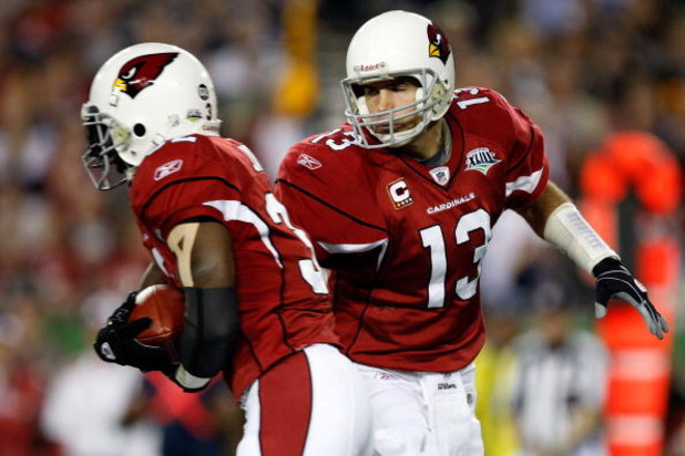 TAMPA, FL - FEBRUARY 01:  Quarterback Kurt Warner #13 of the Arizona Cardinals hands the ball off to running back Edgerrin James #32 against the Pittsburgh Steelers during Super Bowl XLIII on February 1, 2009 at Raymond James Stadium in Tampa, Florida.  (