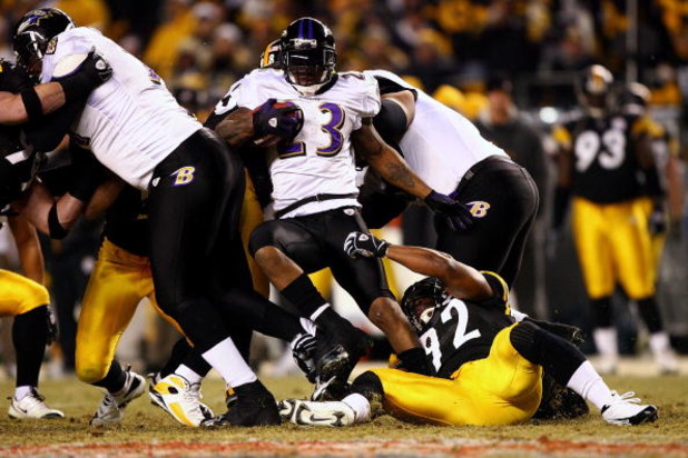 PITTSBURGH - JANUARY 18:  Willis McGahee #23 of the Baltimore Ravens runs the ball against James Harrison #92 of the Pittsburgh Steelers during the AFC Championship game on January 18, 2009 at Heinz Field in Pittsburgh, Pennsylvania. Steelers won 23-14. (
