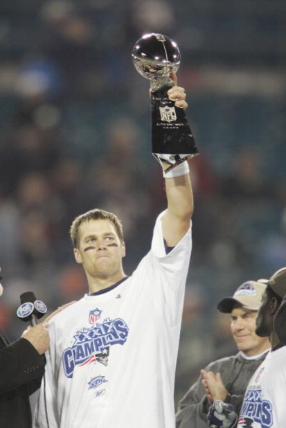 JACKSONVILLE, FL - FEBRUARY 6:  Quarterback Tom Brady #12 of the New England Patriots holds up the Lombardi Trophy after defeating the Philadelphia Eagles in Super Bowl XXXIX at Alltel Stadium on February 6, 2005 in Jacksonville, Florida. The Patriots def