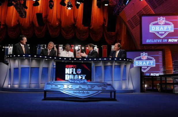NEW YORK - APRIL 26:  The ESPN broadcast team of (L-R) Mel Kiper, Chris Mortensen,Keyshawn Johnson, Steve Young and Chris Berman work the 2008 NFL Draft on April 26, 2008 at Radio City Music Hall in New York City.  (Photo by Jim McIsaac/Getty Images)