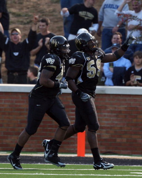 WINSTON SALEM, NC - OCTOBER 27:  Aaron Curry #59 of the Wake Forest Demon Deacons celebrates his touchdown against the UNC Tar Heels during the ACC game at the Groves Stadium on October 27, 2007 in Winston Salem,North Carolina.  (Photo by David Cannon/Get