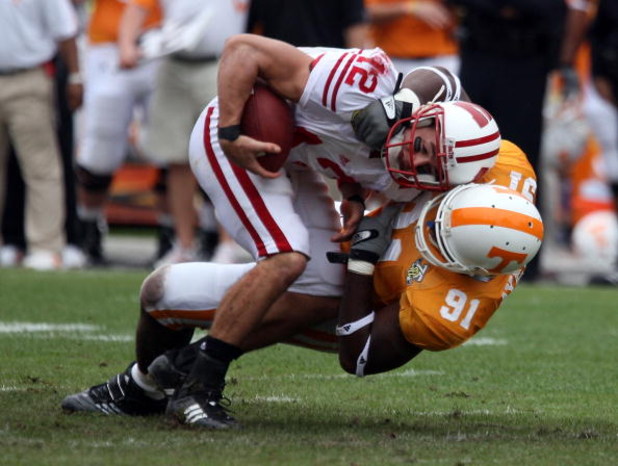 TAMPA, FL - JANUARY 01:  Tyler Donovan #12 of the Wisconsin Badgers is sacked by Robert Ayers #91 of  the Tennessee Volunteers during the Outback Bowl at Raymond James Stadium on January 1, 2008 in Tampa, Florida.  (Photo by Scott Halleran/Getty Images)