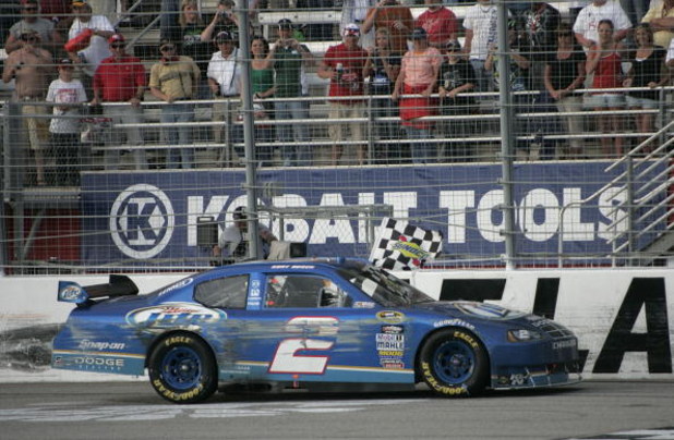 HAMPTON, GA - MARCH 08: Kurt Busch driver of the #2 Miller Lite Dodge celebrates winning the NASCAR Sprint Cup Series Kobalt Tools 500 at the Atlanta Motor Speedway on March 8, 2009 in Hampton, Georgia. (Photo by Jerry Markland/Getty Images for NASCAR)
