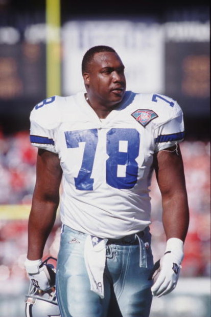 13 NOV 1994:  DEFENSIVE LINEMAN LEON LETT OF THE DALLAS COWBOYS WALKS OFF THE FIELD WITH HELMET IN HAND DURING THE COWBOYS 21-14 LOSS TO THE SAN FRANCISCO 49ERS AT CANDLESTICK PARK IN SAN FRANCISCO, CALIFORNIA.