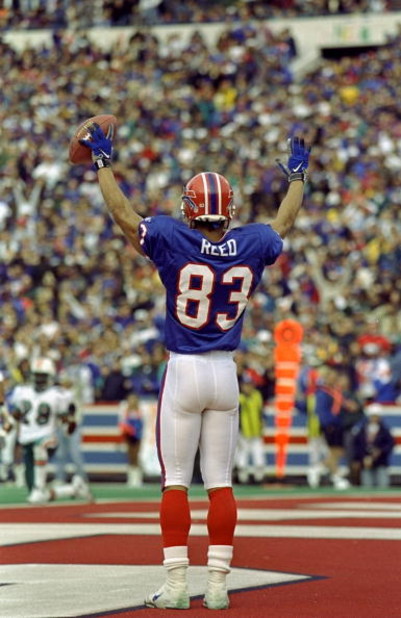 1 Nov 1998:  Andre Reed #83 of the Buffalo Bills celebrates a touch down in the end zone during the game against the Miami Dolphins at the Rich Stadium in Orchard Park, New York. The Bills defeated the Dolphins 30-24. Mandatory Credit: Rick Stewart  /Alls