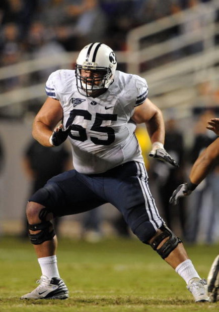 FORT WORTH, TX - OCTOBER 16:  Offensive lineman Dallas Reynolds #65 of the BYU Cougars during play against the TCU Horned Frogs at Amon G. Carter Stadium on October 16, 2008 in Fort Worth, Texas.  (Photo by Ronald Martinez/Getty Images)