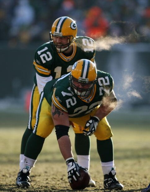 GREEN BAY, WI - DECEMBER 28: Aaron Rodgers #12 of the Green Bay Packers awaits the snap from George Foster #72 during a game against the Detroit Lions on December 28, 2008 at Lambeau Field in Green Bay, Wisconsin. The Packers defeated the Lions 31-21. (P