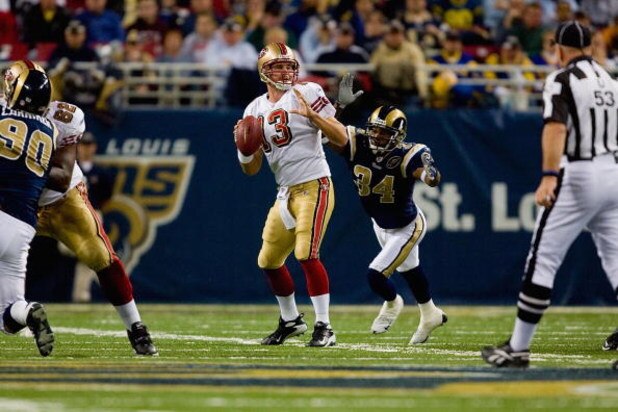 ST. LOUIS, MO - DECEMBER 21: Fakhir Brown #34 of the St. Louis Rams bears down upon an unsuspecting Shaun Hill #13 of the San Francisco 49ers during the game at the Edward Jones Dome on December 21, 2008 in St. Louis, Missouri. The 49ers won 17-16. (Phot