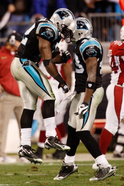 CHARLOTTE, NC - JANUARY 10:  (L-R) Jon Beason #52 and Chris Harris #43 of the Carolina Panthers celebrate a play during the game against the Arizona Cardinals during the NFC Divisional Playoff Game on January 10, 2009 at Bank of America Stadium in Charlot