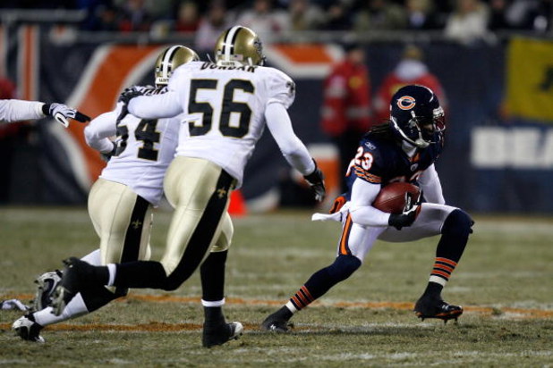 CHICAGO - DECEMBER 11:  Devin Hester #23 of the Chicago Bears returns a punt against the New Orleans Saints at Soldier Field on December 11, 2008 in Chicago, Illinois.  (Photo by Jonathan Daniel/Getty Images)