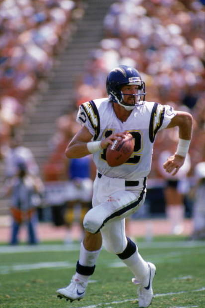 LOS ANGELES - SEPTEMBER 4:  Quarterback Babe Laufenberg #12 of the San Diego Chargers runs with the ball during a game against the Los Angeles Raiders at the Los Angeles Memorial Coliseum on September 4, 1988 in Los Angeles, California.  The Raiders won 2