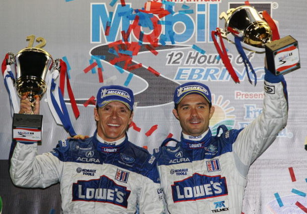 SEBRING, FL - MARCH 21: Adrian Fernandez (L), and Luis Diaz of the #15 Lowe's Fernandez Racing Acura ARX-01B celebrate their victory in the LMP2 class during the 57th Annual Mobil1 12 Hours of Sebring at Sebring International Raceway on March 21, 2009 in