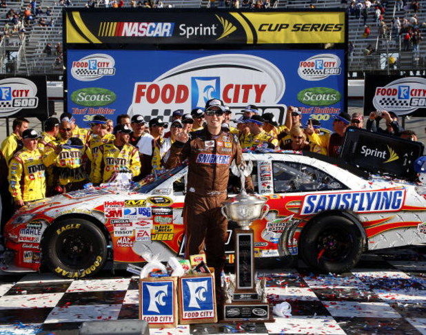 BRISTOL, TN - MARCH 22: Kyle Busch, driver of the #18 Snickers Toyota, poses in victory lane after winning the NASCAR Sprint Cup Series Food City 500 at Bristol Motor Speedway on March 22, 2009 in Bristol, Tennessee. (Photo by John Harrelson/Getty Image