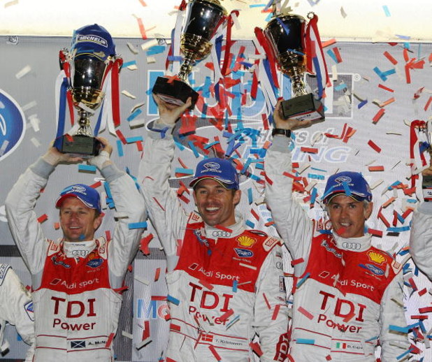 SEBRING, FL - MARCH 21: (L-R) Allan McNish, Tom Kristensen and Rinaldo Capello of the #2 Audi Sport Team Joest Audi R15 TDI celebrate after their class and overall victory in the 57th Annual Mobil1 12 Hours of Sebring at Sebring International Raceway on