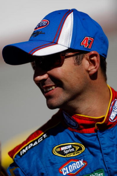 BRISTOL, TN - MARCH 20: Marcos Ambrose, driver of the #47 Little Debbie/Cloroz/Kingsford Toyota stands by his car during qualifying for the NASCAR Sprint Cup Series Food City 500 at Bristol Motor Speedway on March 20, 2009 in Bristol, Tennessee. (Photo