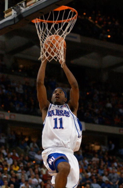 24 Mar 2002: Aaron Miles #11 of Kansas shoots for two against Oregon during the NCAA Men's Basketball Tournament at the Kohl Center in Madison, Wisconsin. The Kansas Jayhawks beat the Oregon Ducks 104-86 to advance to the Final Four in Atlanta, Georgia. D