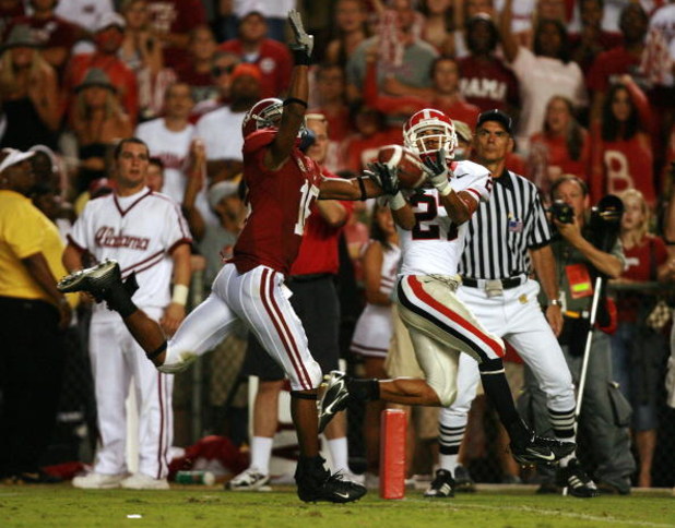 TUSCALOOSA, AL - SEPTEMBER 22:  Split end Mikey Henderson #27 of the Georgia Bulldogs catches the game winning touchdown in overtime over defensive back Lionel Mitchell #16 of the Alabama Crimson Tide at Bryant-Denny Stadium at Bryant-Denny Stadium Septem