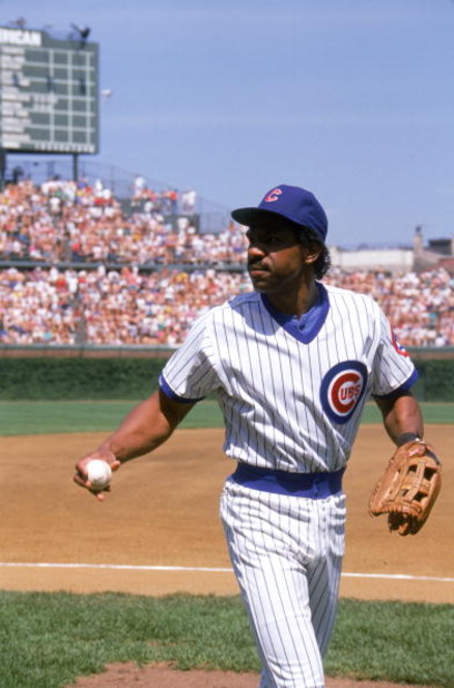 CHICAGO - 1989:  Andre Dawson #8 of the Chicago Cubs walks on the field with a ball in his hand during a game in 1989 at Wrigley Field in Chicago, Illinois.  (Photo by Jonathan Daniel/Getty Images)     