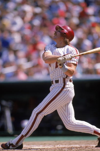 PHILADELPHIA - 1989:  Mike Schmidt #20 of the Philadelphia Phillies watches the flight of the ball during a 1989 season game at Veterans Stadium in Philadelphia, Pennsylvania. (Photo by Rick Stewart/Getty Images)