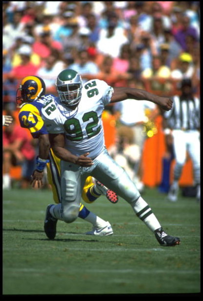 23 SEP 1990:  PHILADELPHIA EAGLES DEFENSIVE END REGGIE WHITE  IS IN PURSUIT OF THE LOS ANGELES RAMS QUARTERBACK DURING THE EAGLES 27-21 VICTORY OVER THE RAMS AT ANAHEIM STADIUM IN ANAHEIM, CALIFORNIA.