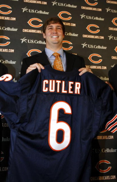 LAKE FOREST, IL - APRIL 3: Quarterback Jay Cutler of the Chicago Bears holds up his #6 jersey after he was introduced as their new quarterback during a press conference on April 3, 2009 at Halas Hall in Lake Forest, Illinois. (Photo by Jim Prisching/Getty