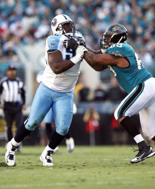 JACKSONVILLE, FL - NOVEMBER 16: Offensive lineman Khalif Barnes #69 of the Jacksonville Jaguars tries to stop defensive lineman Albert Haynesworth #92 of the Tennessee Titans at Jacksonville Municipal Stadium on November 16, 2008 in Jacksonville, Florida