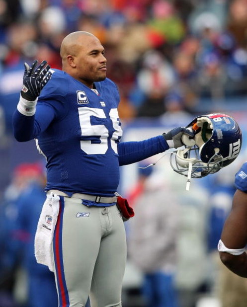 EAST RUTHERFORD, NJ - DECEMBER 07: Antonio Pierce #58 of the New York Giants gestures against the Philadelphia Eagles at Giants Stadium on December 7, 2008 in East Rutherford, New Jersey.  (Photo by Nick Laham/Getty Images)