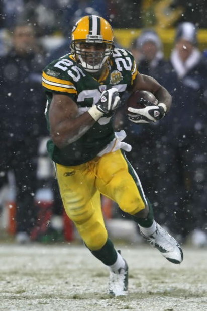 GREEN BAY, WI - JANUARY 12:  Running back Ryan Grant #25 of the Green Bay Packers runs the ball against the Seattle Seahawks during the NFC divisional playoff game on January 12, 2008 at Lambeau Field in Green Bay, Wisconsin. The Packers defeated the Seah