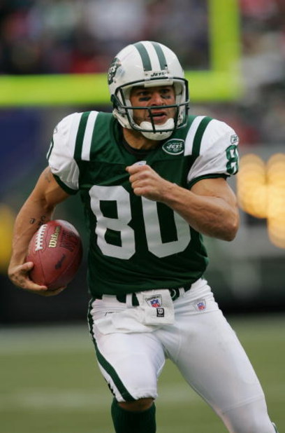 RUTHERFORD, NJ - OCTOBER 17:  Wide receiver Wayne Chrebet #80 of the New York Jets runs with the ball during a game against the San Francisco 49ers at Giants Stadium on October 17, 2004 in East Rutherford, New Jersey.  The Jets defeated the 49ers 22-14.  