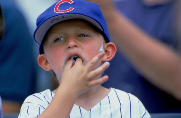 20 Jul 2000:  A young fan of the Chicago Cubs eats cotton candy during the game against the Philadelphia Phillies at Wrigley Field in Chicago, Illinois.  The Phillies defeated the Cubs 3-2.Mandatory Credit: Jonathan Daniel  /Allsport
