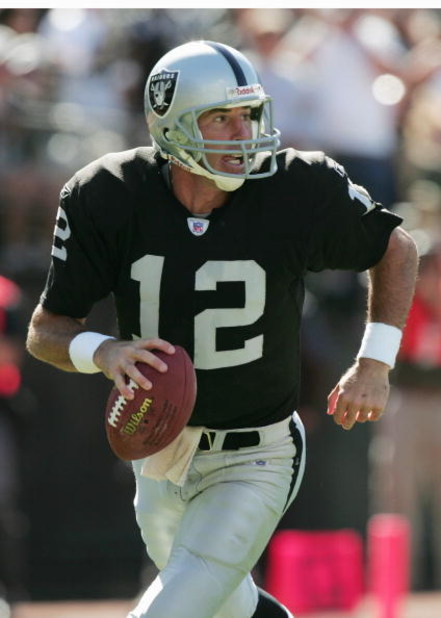 OAKLAND, CA - SEPTEMBER 19:  Quarterback Rich Gannon #12 of the Oakland Raiders scrambles with the ball during the game against the Buffalo Bills at Network Associates Coliseum on September 19, 2004 in Oakland, California. The Raiders defeated the Bills 1