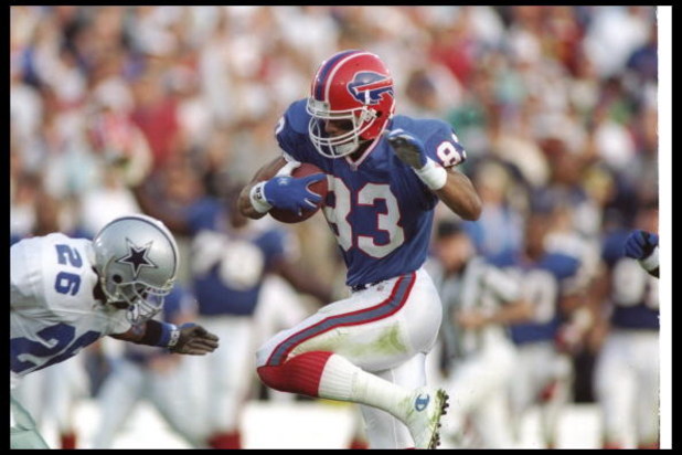 31 Jan 1993:  Wide receiver Andre Reed of the Buffalo Bills moves the ball during Super Bowl XXVII against the Dallas Cowboys at the Rose Bowl in Pasadena, California.  The Cowboys won the game, 52-17. Mandatory Credit: Rick Stewart  /Allsport