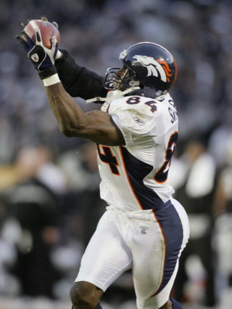 OAKLAND, CA - DECEMBER 22:  Tight end Shannon Sharpe #84 of the Denver Broncos catches a pass during the NFL game against the Oakland Raiders on December 22, 2002 at Network Associates Coliseum in Oakland, California.  The Raiders defeated the Broncos 28-