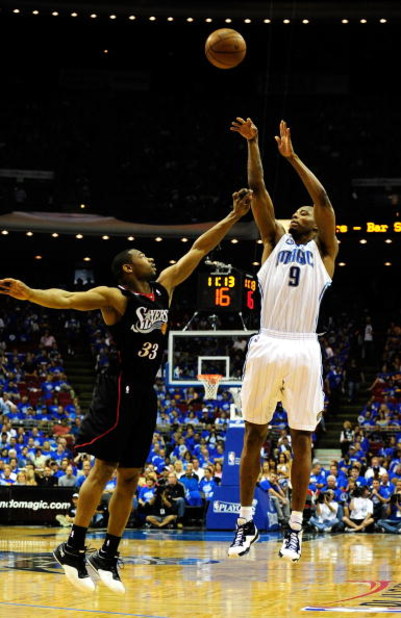 ORLANDO, FL - APRIL 19:  Rashard Lewis #9 of the Orlando Magic shoots over Willie Green #33 of the Philadelphia 76ers in Game One of the Eastern Conference Quarterfinals during the 2009 NBA Playoffs at Amway Arena on April 19, 2009 in Orlando, Florida.  N
