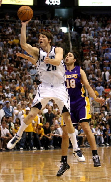 SALT LAKE CITY - MAY 11: Kyle Korver #26 of the Utah Jazz shoots the ball against Sasha Vujacic #18 of the Los Angeles Lakers in Game Four of the Western Conference Semifinals during the 2008 NBA Playoffs on May 11, 2008 at Energy Solutions Arena in Salt 