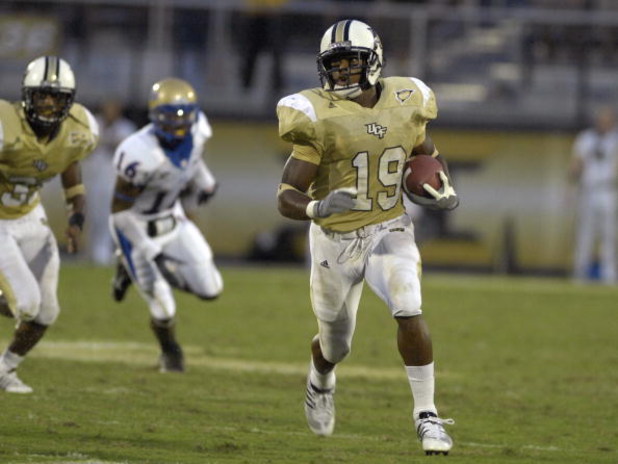 ORLANDO, FL - OCTOBER 20: Defensive back Joe Burnett #19 of the University of Central Florida Golden Knights rushes upfield against the Tulsa Golden Hurricane at Bright House Stadium on October 20, 2007 in Orlando, Florida. UCF won 44 - 23. (Photo by Al