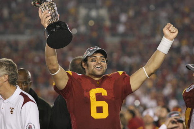 PASADENA, CA - JANUARY 1:  Mark Sanchez #6 of the USC Trojans rejoices as he holds the Rose Bowl Trophy after the game against the Penn State Nittany Lions on January 1, 2009 at the Rose Bowl in Pasadena, California.  USC won 38-24.  (Photo by Jeff Golden