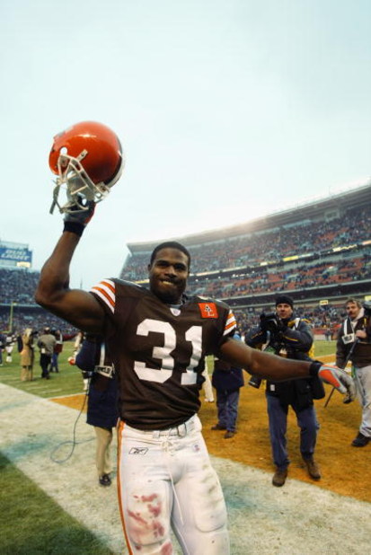 CLEVELAND - DECEMBER 29:  Running back William Green #31 of the Cleveland Browns raises his helmet to celebrate the defeat of the Atlanta Falcons in the NFL game at Cleveland Browns Stadium on December 29, 2002 in Cleveland, Ohio.  The Browns defeated the