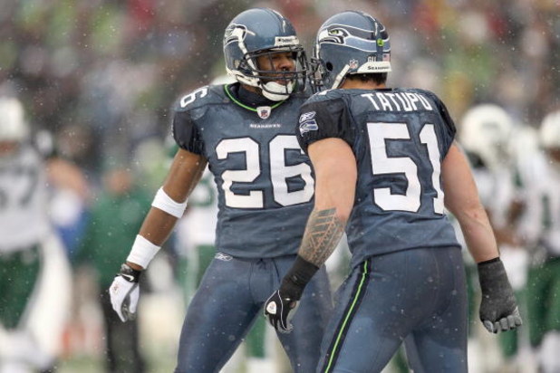 SEATTLE - DECEMBER 21:  Josh Wilson #26 and Lofa Tatupu #51 of the Seattle Seahawks celebrate during the game against the New York Jets on December 21, 2008 at Qwest Field in Seattle, Washington. The Seahawks defeated the Jets 13-3. (Photo by Otto Greule 