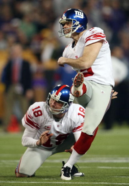 MINNEAPOLIS - DECEMBER 28:   John Carney #5 of the New York Giants kicks a field goal as Jeff Feagles #18 holds in the second quarter against the Minnesota Vikings on December 28, 2008 at the Hubert H. Humphrey Metrodome in Minneapolis, Minnesota. (Photo 
